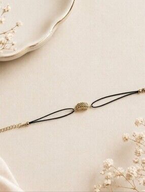 Delicate Black Cord Bracelet with Gold Leaf Accent